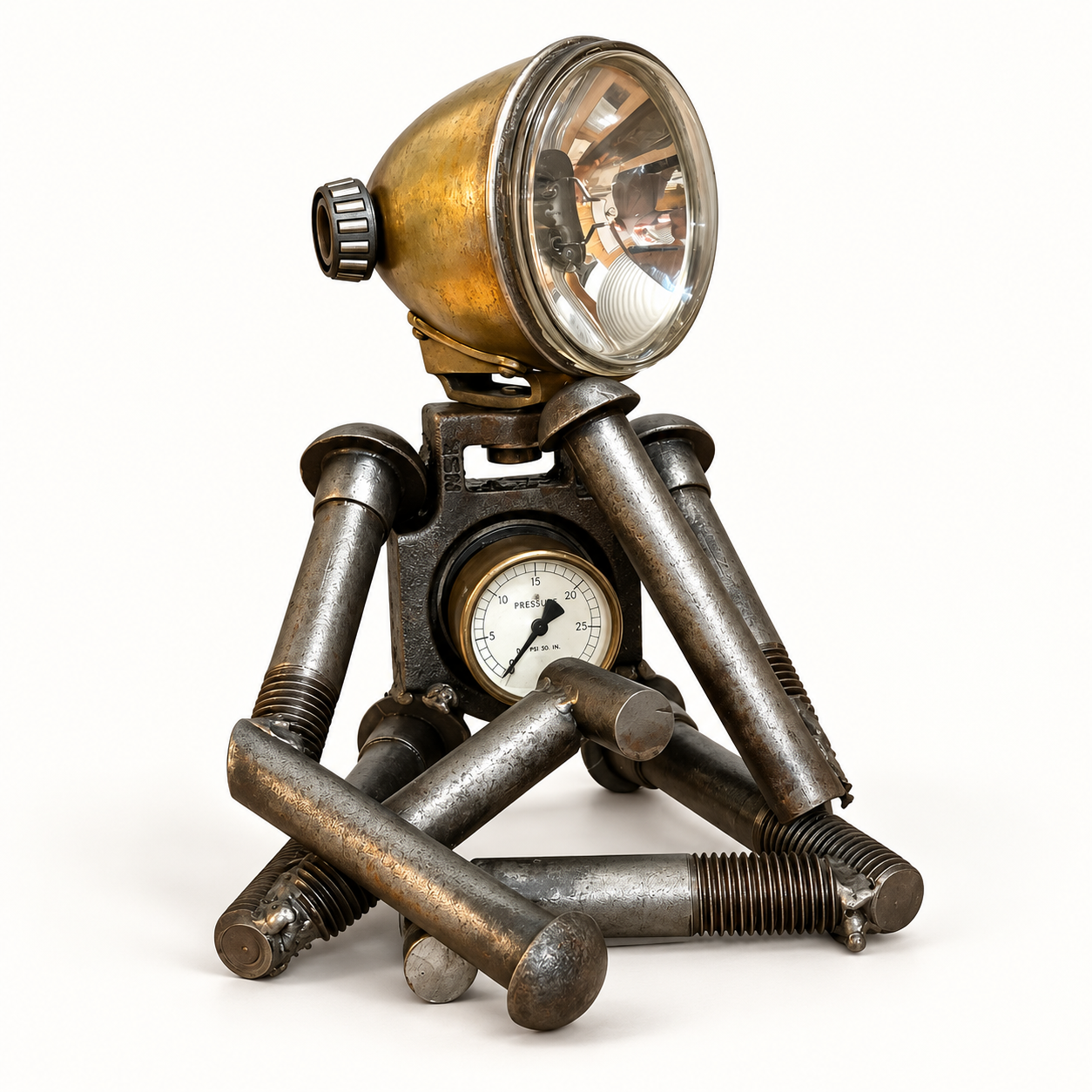 Small robot sculpture made from bolts, a headlamp and reclaimed mechanical parts
